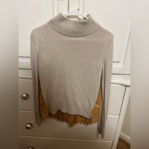 Anthropologie sweater. Beige and fun accordion print on the back